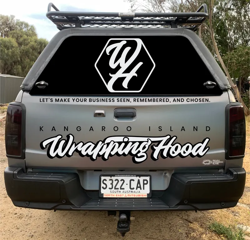 Rear tailgate detail of matte colour-shift vehicle wrap with reflective logo and lettering, Mitsubishi Triton, Kangaroo Island